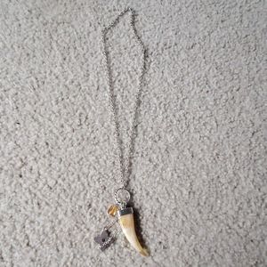 A silver and orange necklace